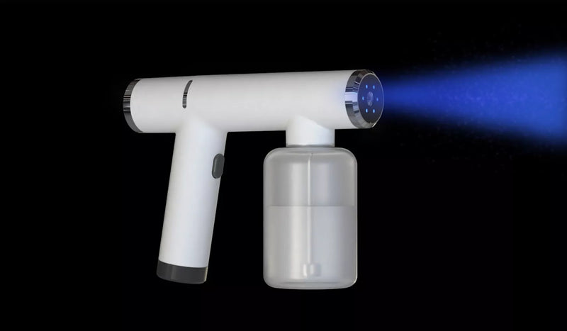 A handheld sprayer gun and its attachment on a black background